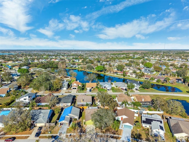 bird's eye view featuring a residential view and a water view