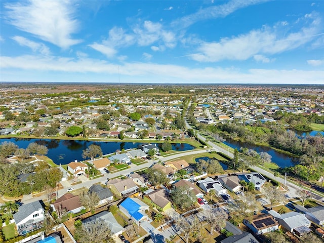 birds eye view of property featuring a water view and a residential view