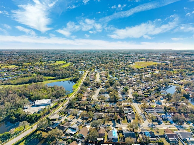 birds eye view of property featuring a water view and a residential view