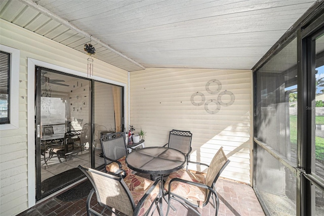 sunroom / solarium with lofted ceiling