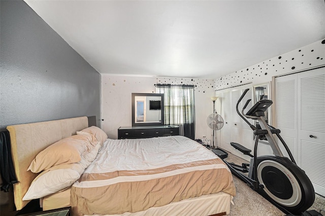 carpeted bedroom with multiple closets