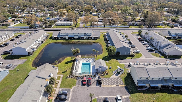 birds eye view of property with a residential view and a water view