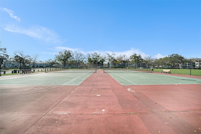 view of sport court with fence