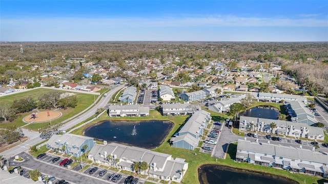 aerial view featuring a residential view and a water view