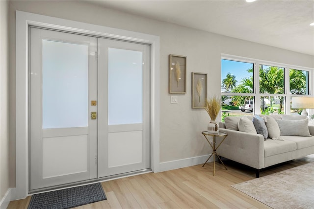 interior space featuring baseboards and light wood-style floors