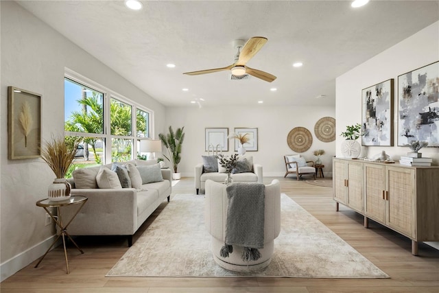 living room featuring light wood finished floors and recessed lighting