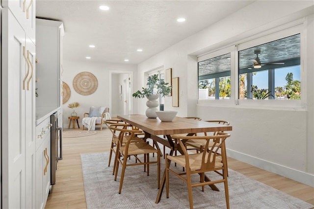 dining space featuring recessed lighting, baseboards, light wood-type flooring, and a ceiling fan