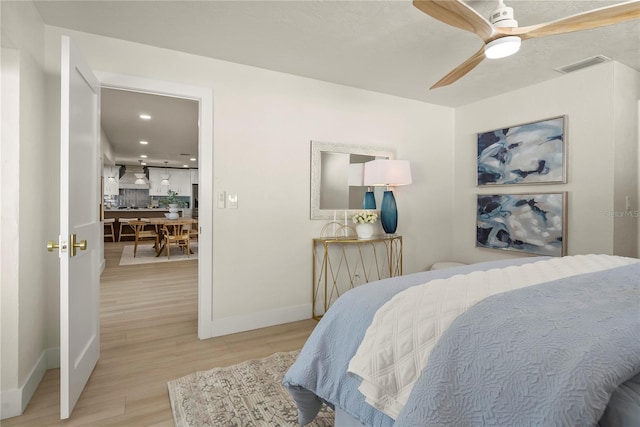 bedroom with visible vents, a ceiling fan, wood finished floors, recessed lighting, and baseboards