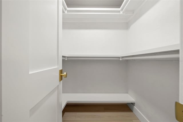 walk in closet featuring light wood-type flooring