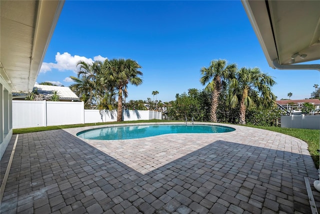 view of swimming pool featuring a fenced in pool, a patio, and a fenced backyard