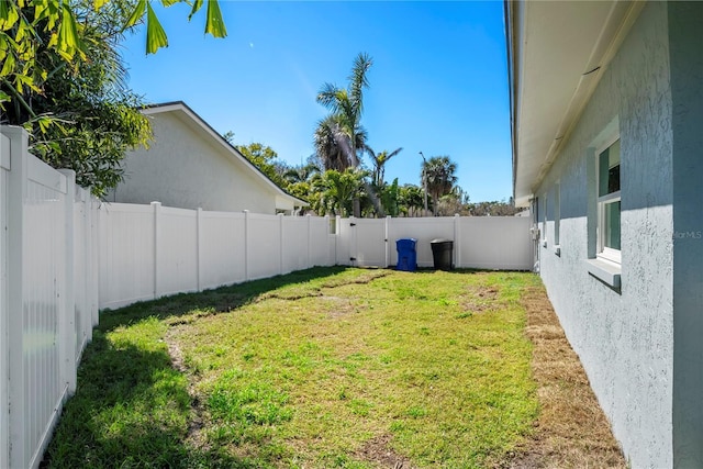 view of yard with a fenced backyard