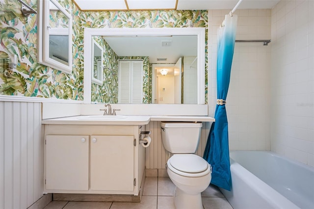 full bathroom with shower / bath combination with curtain, wallpapered walls, toilet, vanity, and tile patterned floors