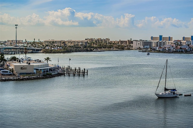 exterior space with a water view and a city view