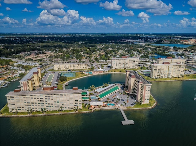 birds eye view of property with a water view and a city view