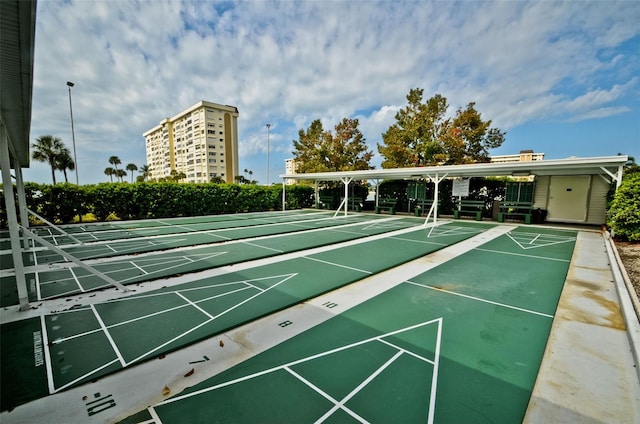 view of home's community featuring shuffleboard