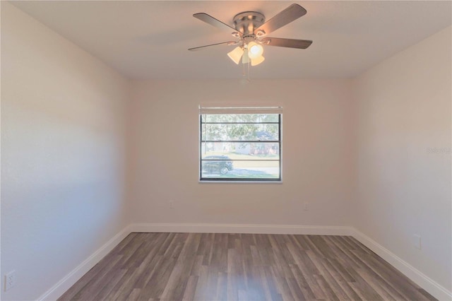 unfurnished room featuring ceiling fan, baseboards, and wood finished floors