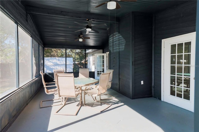 sunroom with a ceiling fan