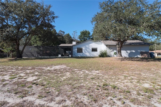 exterior space featuring a yard and a chimney