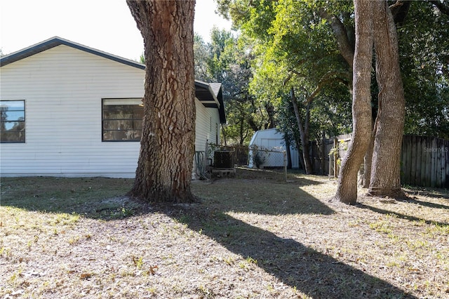 view of property exterior with fence