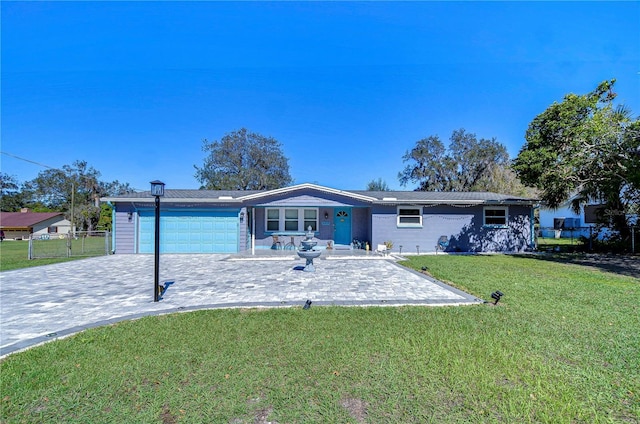 ranch-style home with a front lawn and a garage