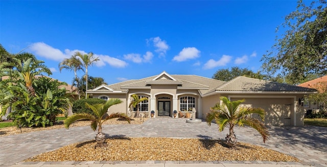 mediterranean / spanish house featuring a garage