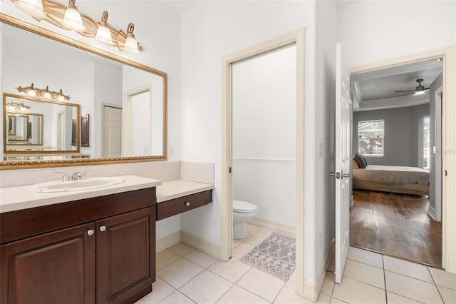 bathroom with vanity, ceiling fan, tile patterned flooring, and toilet