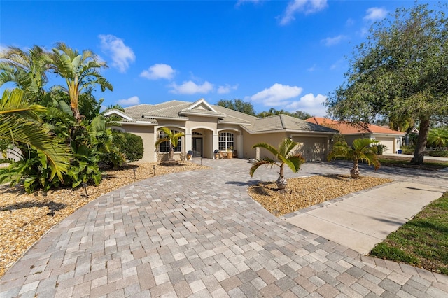 view of front of property with a garage