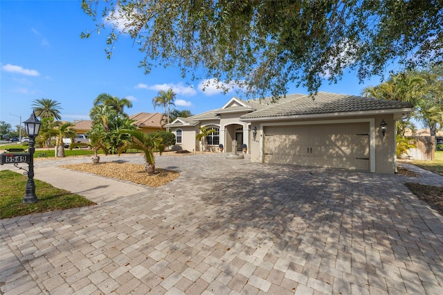 single story home featuring a garage