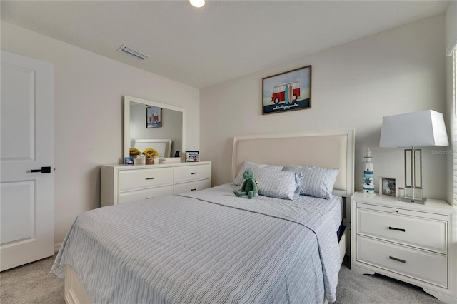 bedroom with light colored carpet and visible vents