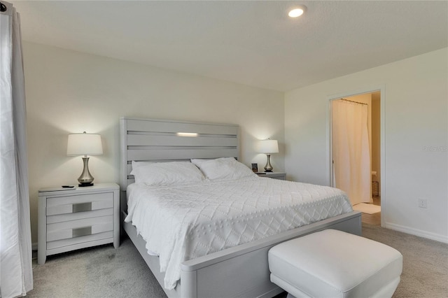 bedroom with carpet flooring and baseboards