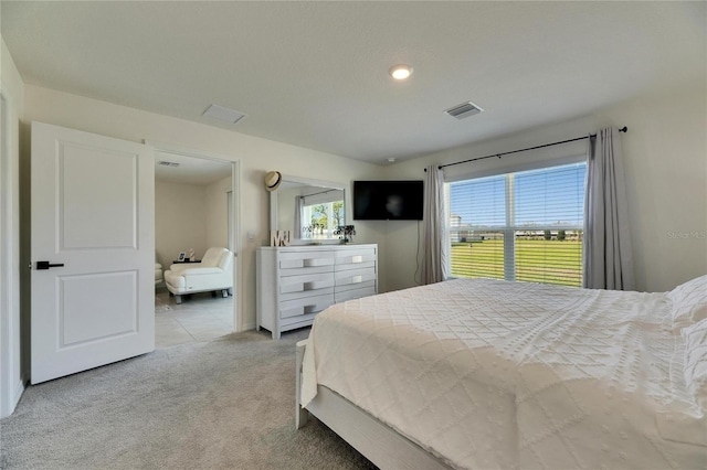 bedroom with carpet and visible vents