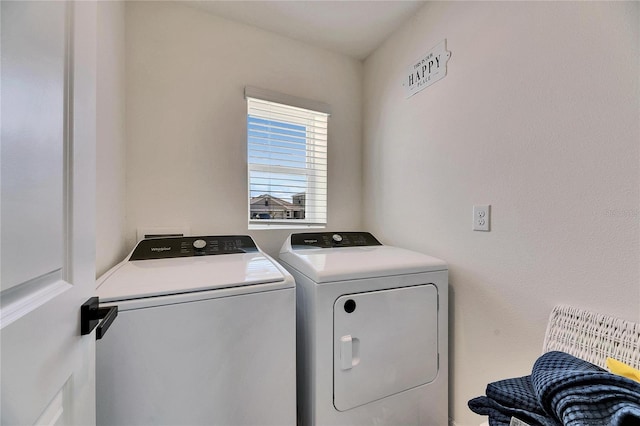 washroom with laundry area and separate washer and dryer