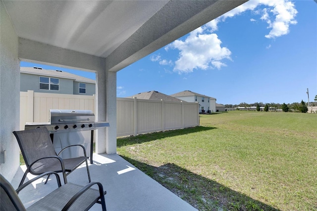 view of yard featuring a patio area and fence