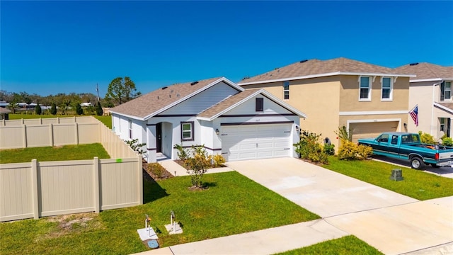 view of front facade featuring stucco siding, a shingled roof, a front yard, fence, and driveway