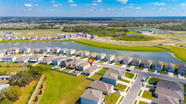 birds eye view of property featuring a residential view and a water view