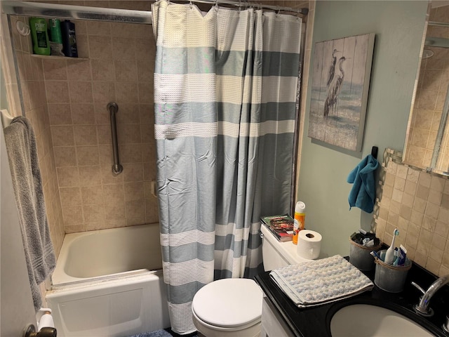 full bathroom featuring a sink, shower / bathtub combination with curtain, and toilet