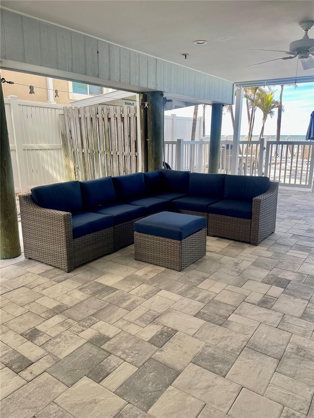 view of patio with ceiling fan and outdoor lounge area