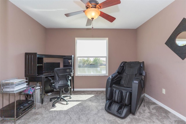 office space featuring ceiling fan, baseboards, and carpet