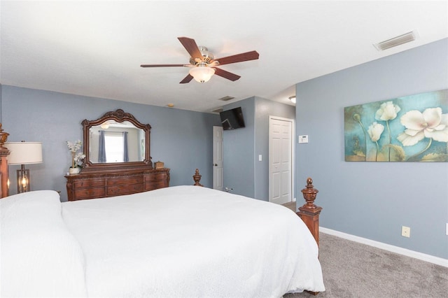 carpeted bedroom featuring visible vents, a ceiling fan, and baseboards