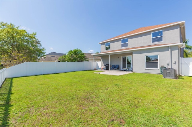 back of house featuring a lawn, cooling unit, stucco siding, a fenced backyard, and a patio