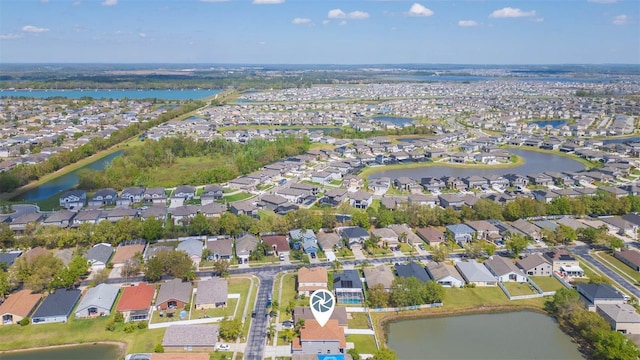 bird's eye view featuring a residential view and a water view