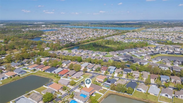 aerial view featuring a residential view and a water view