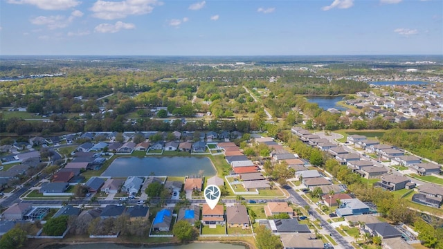 bird's eye view with a residential view and a water view