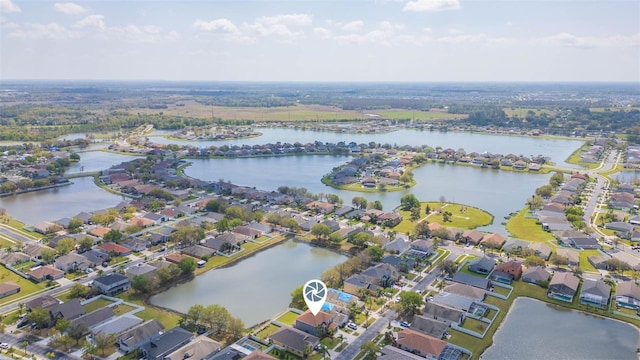 bird's eye view with a residential view and a water view