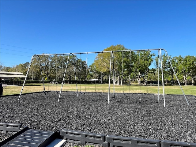 community jungle gym with a lawn