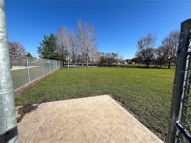 view of yard with a patio and fence