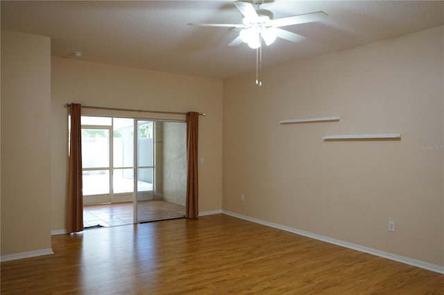 19432 Haskell Pl, Land O Lakes, FL 34638 - unfurnished room with wood finished floors and a ceiling fan