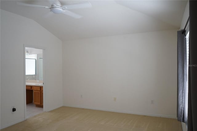19432 Haskell Pl, Land O Lakes, FL 34638 - unfurnished bedroom with vaulted ceiling, light carpet, and connected bathroom
