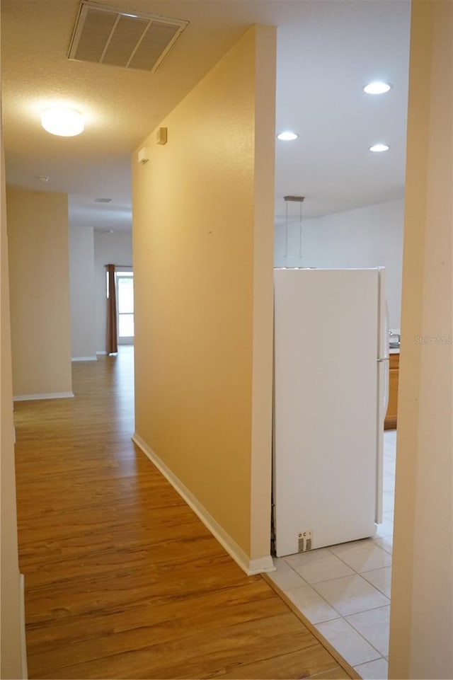 19432 Haskell Pl, Land O Lakes, FL 34638 - hall with light wood-style flooring and recessed lighting