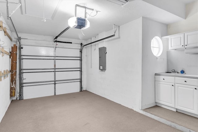 garage with a sink, electric panel, and a garage door opener